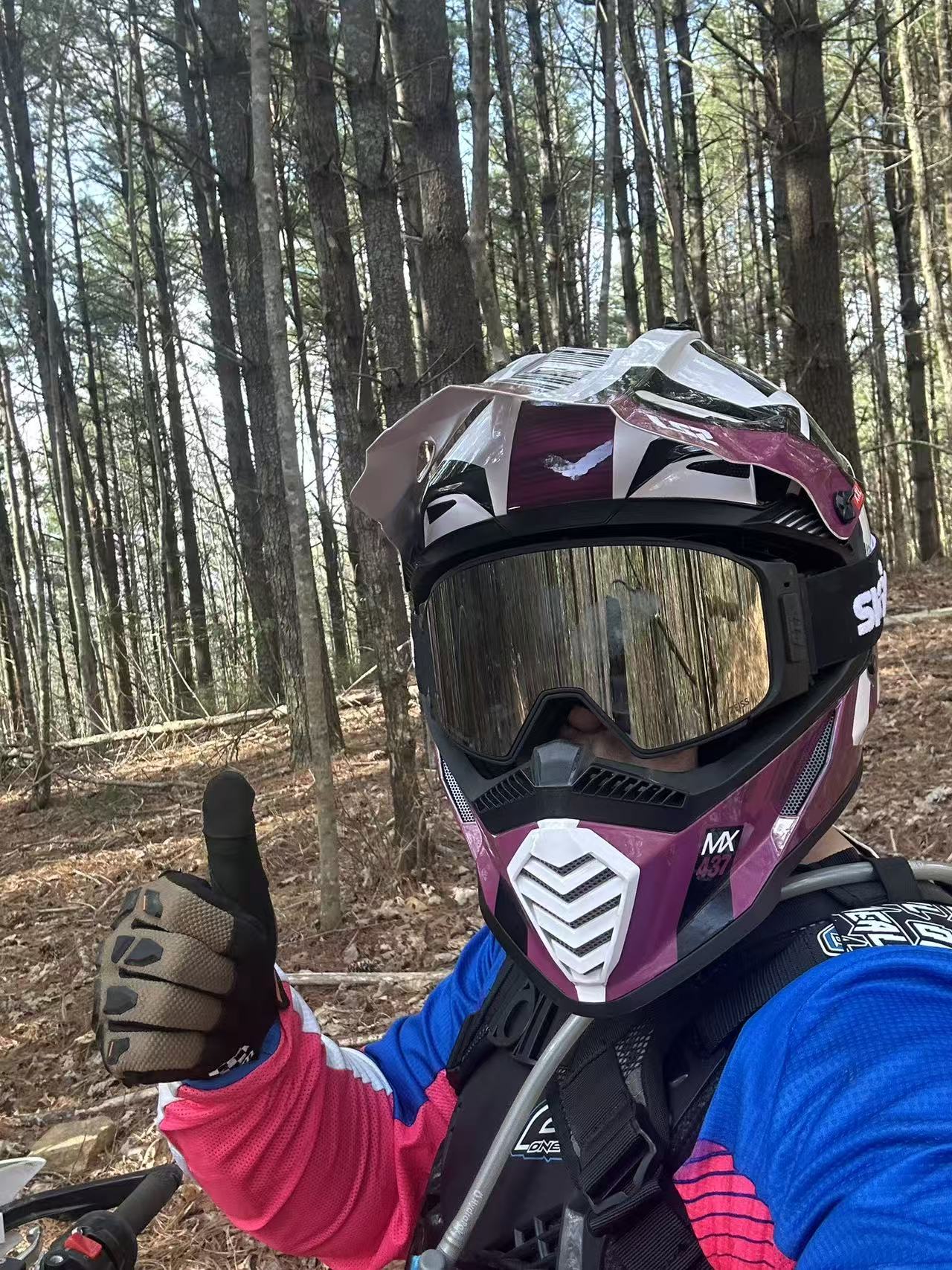 A trail-riding self-portrait in motocross gear